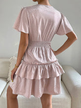 Robe imprimée à col surplis et manches bouffantes